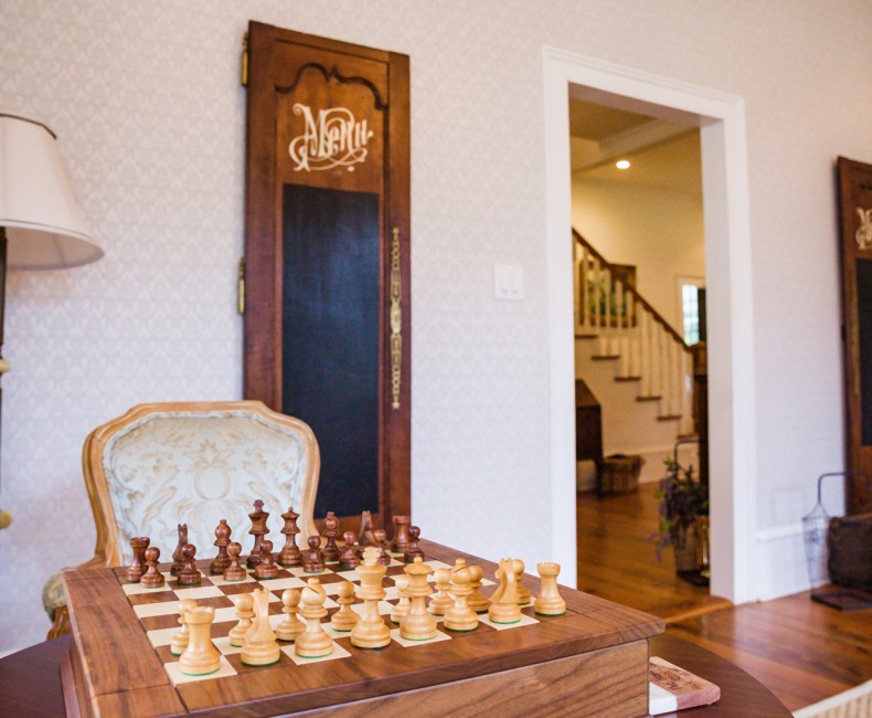 wooden chess set in sitting room