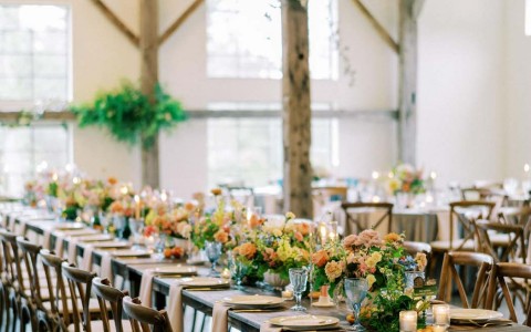 long table decorated with lots of florals 