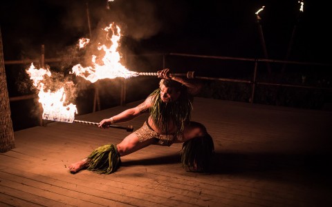 a person doing a fire torch performance