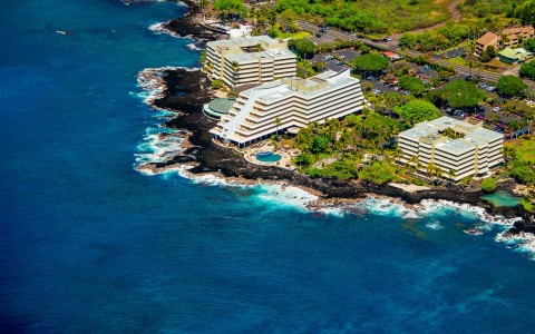 Aerial view of side of the hotel surrounded by the beautiful sea