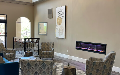 hotel lobby with seating and fireplace