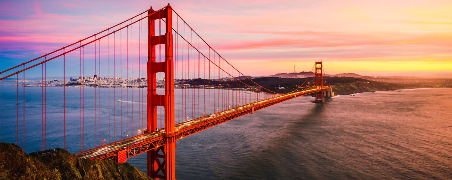 Side view of red bridge spanning water