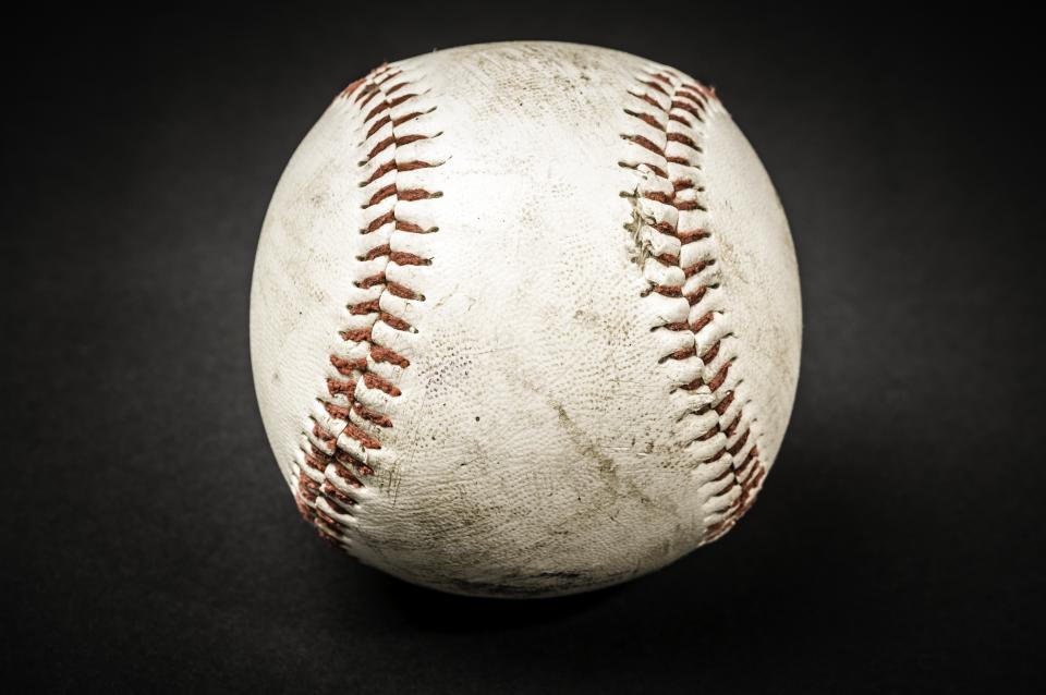 Game used baseball with black background