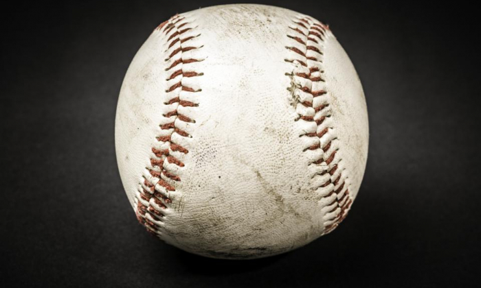Game used baseball with black background