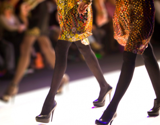 Close up of women with heels on runway