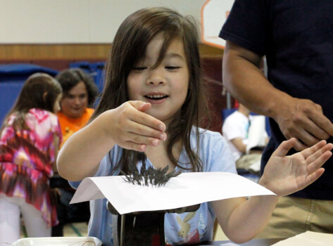 Girl Experimenting at Science Museum