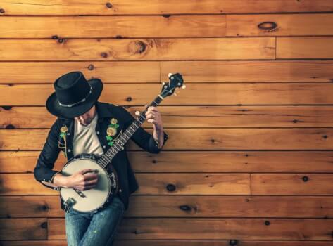 man strumming a banjo