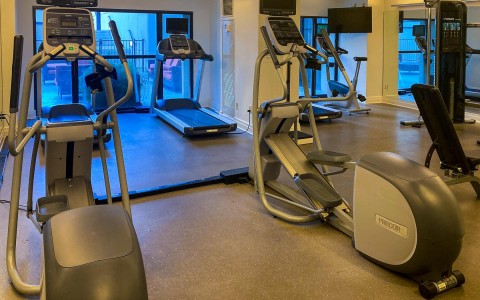 row of elliptical machines and treadmill