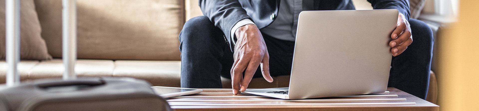 closeup of a man working on a laptop