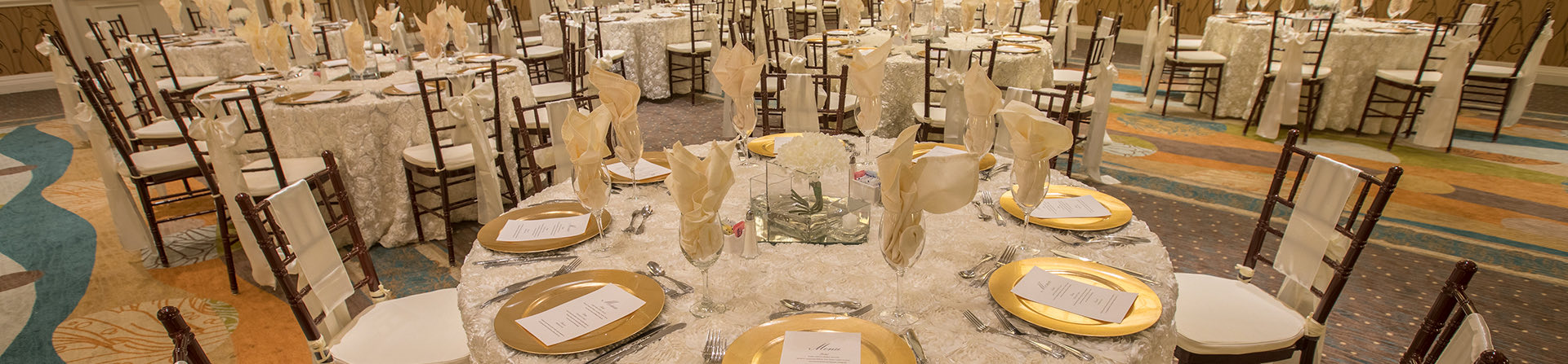 close up of round tables with white decorations