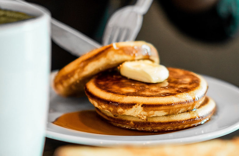 closeup of pancake stack with butter