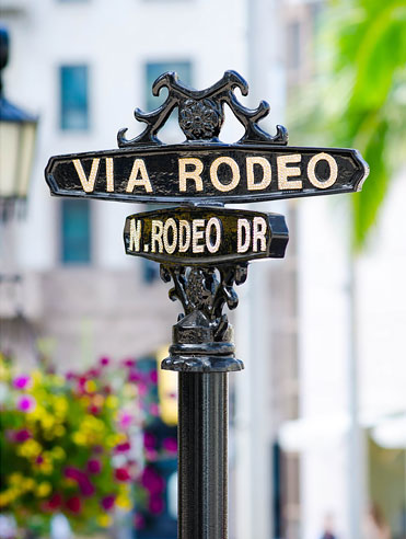 Via Rodeo metal street crossing sign