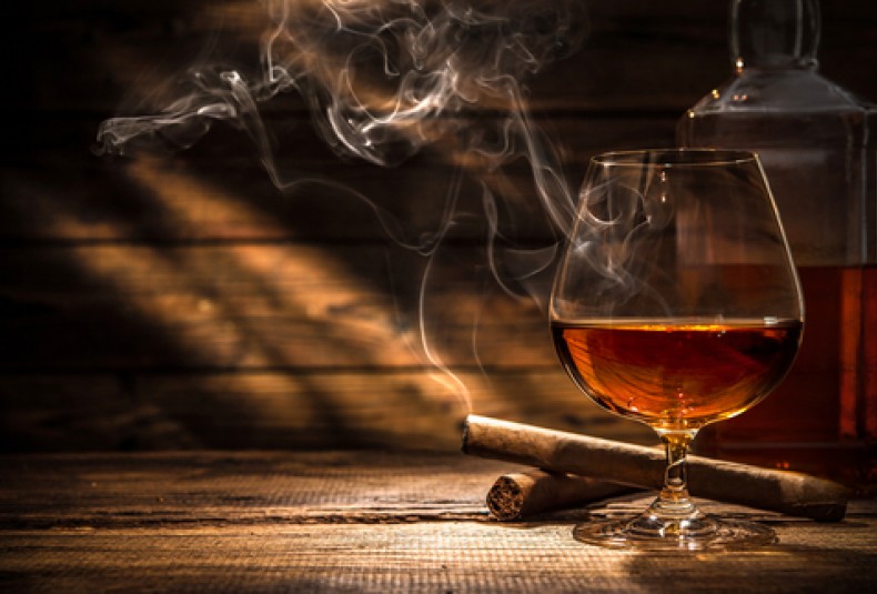 cigar and whiskey in a suana
