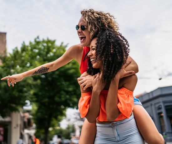 2 girls having a lot of fun