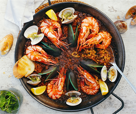 plate of paella with prawns and mussels
