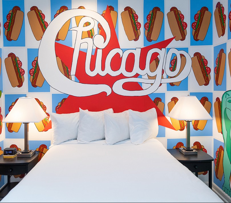 womans head with chicago above a guest bed