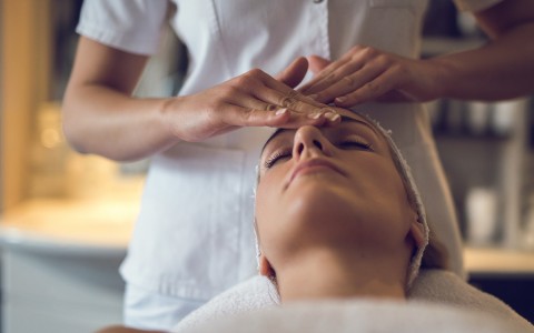 close up view of a woman having a facial massage