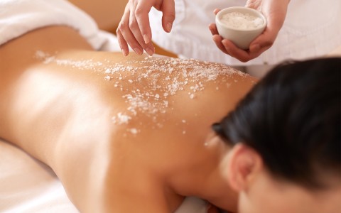 woman getting a massage with salt