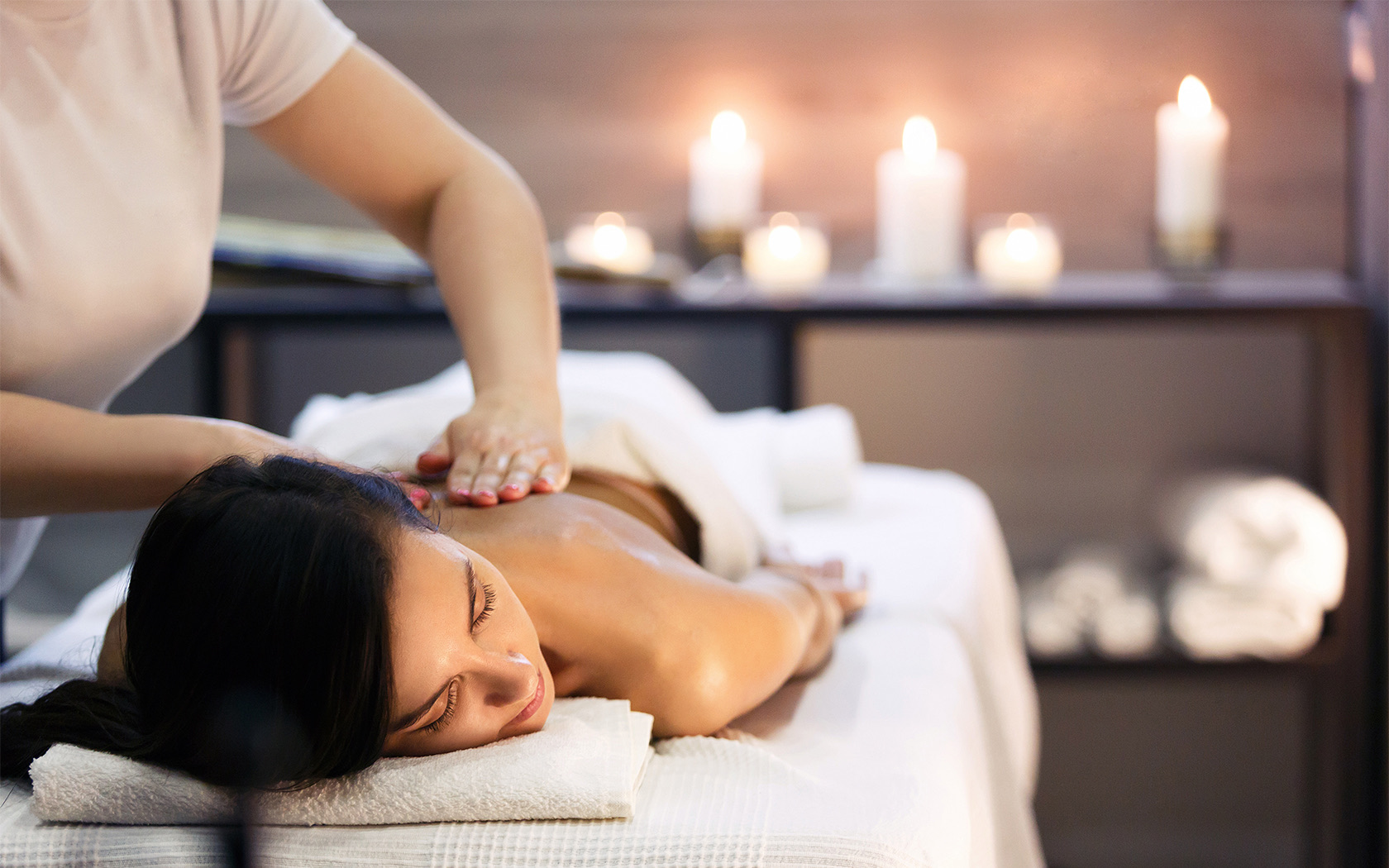 Woman getting a back massage at spa