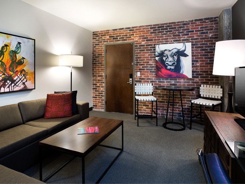 living room in a suite with brick wall