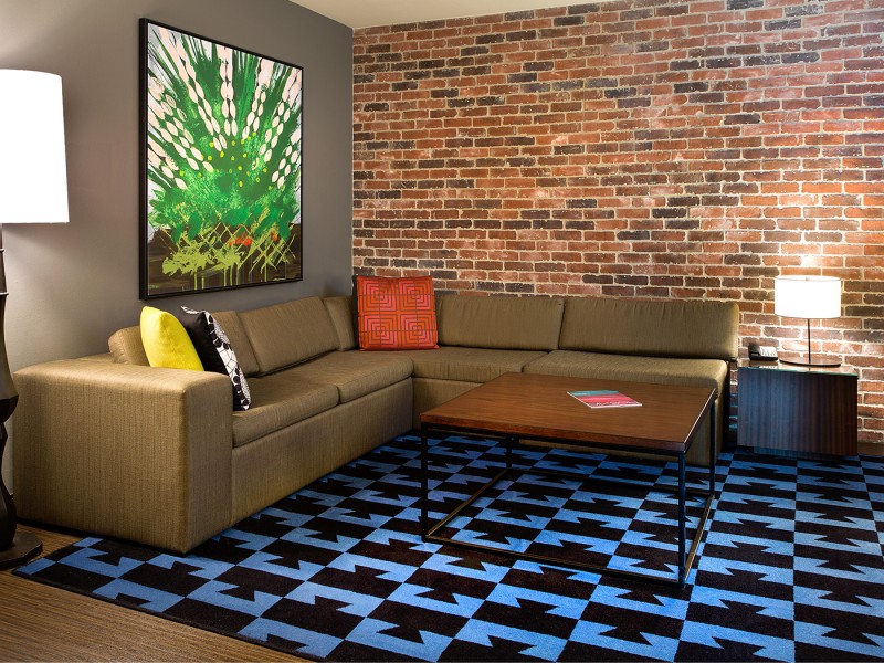 sectional couch and blue accent rug