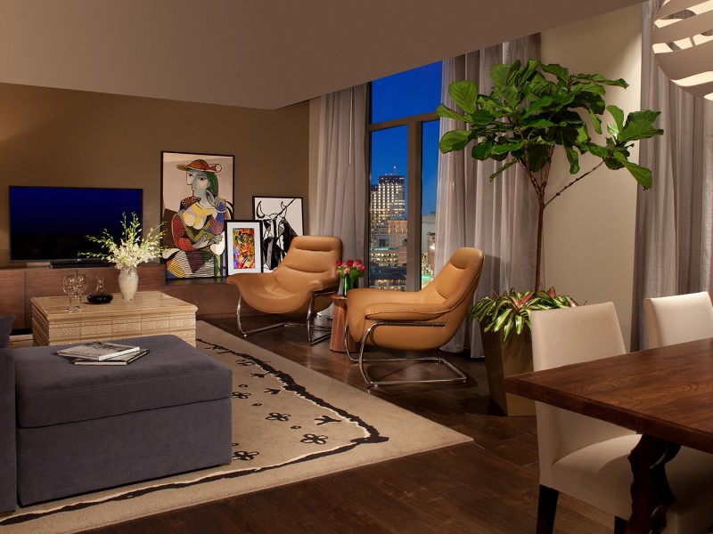 large contessa suite with living room and beige chairs