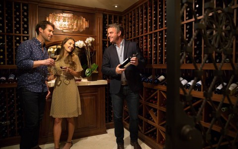 Group of friends in wine cellar