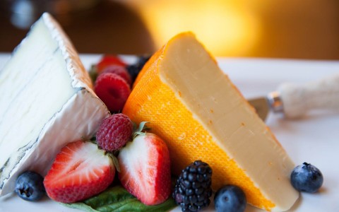 Cheese and fruit on plate