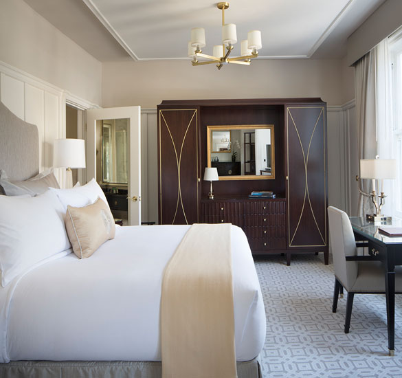 bedroom with white and beige linens 