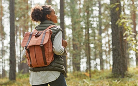 woman with a backpack hiking 