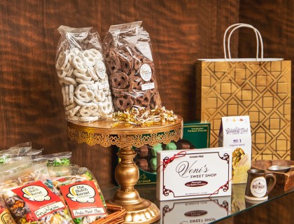 Chocolate items displayed on table with chocolate covered pretzels 