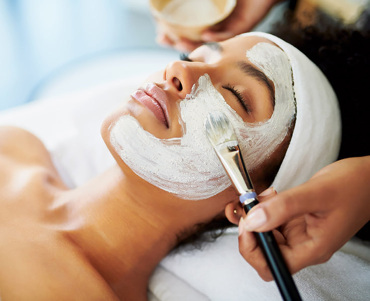 woman getting a facial at the spa