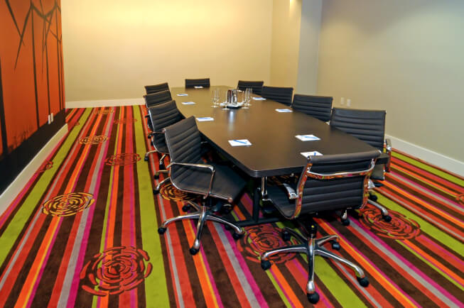 meeting room with chairs surrounding table