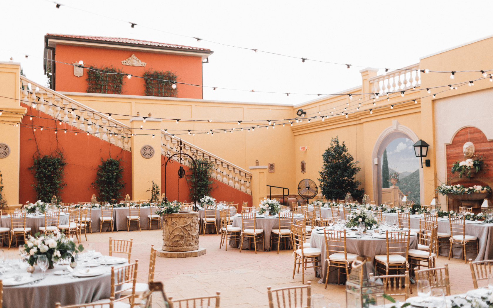 outdoor wedding reception set up in courtyard