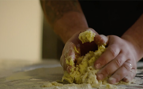 man kneading dough 