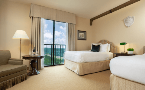 Guest room with double beds and Hill Country views