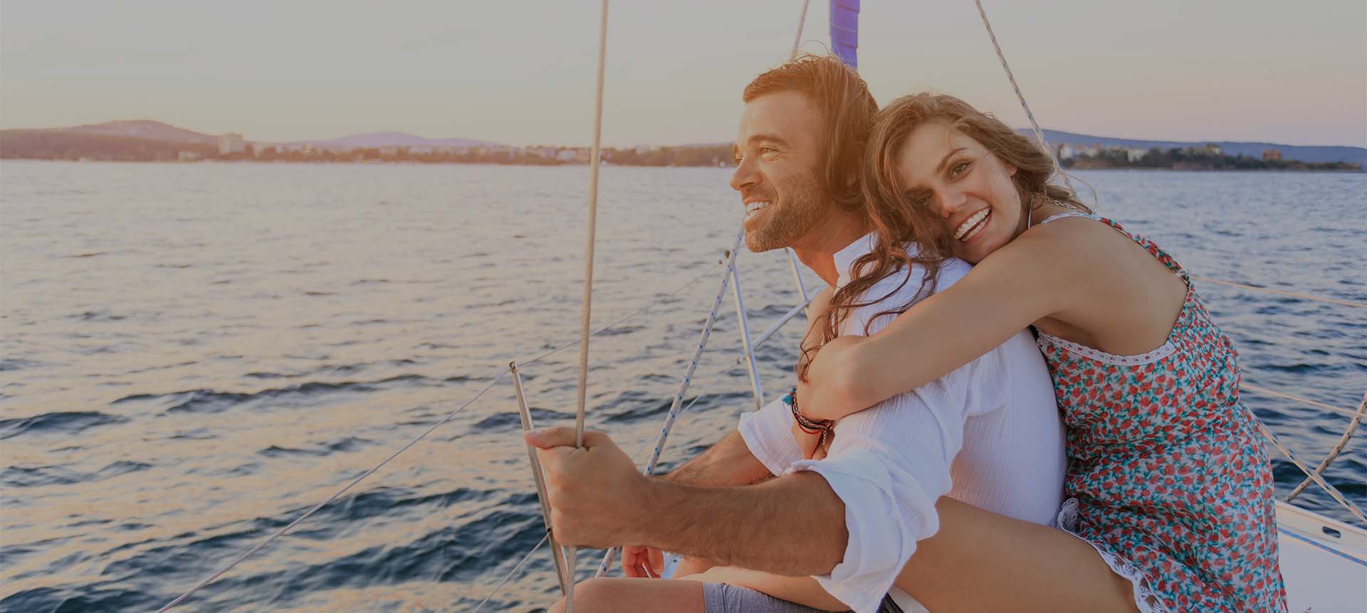Couple embracing each other on a boat 