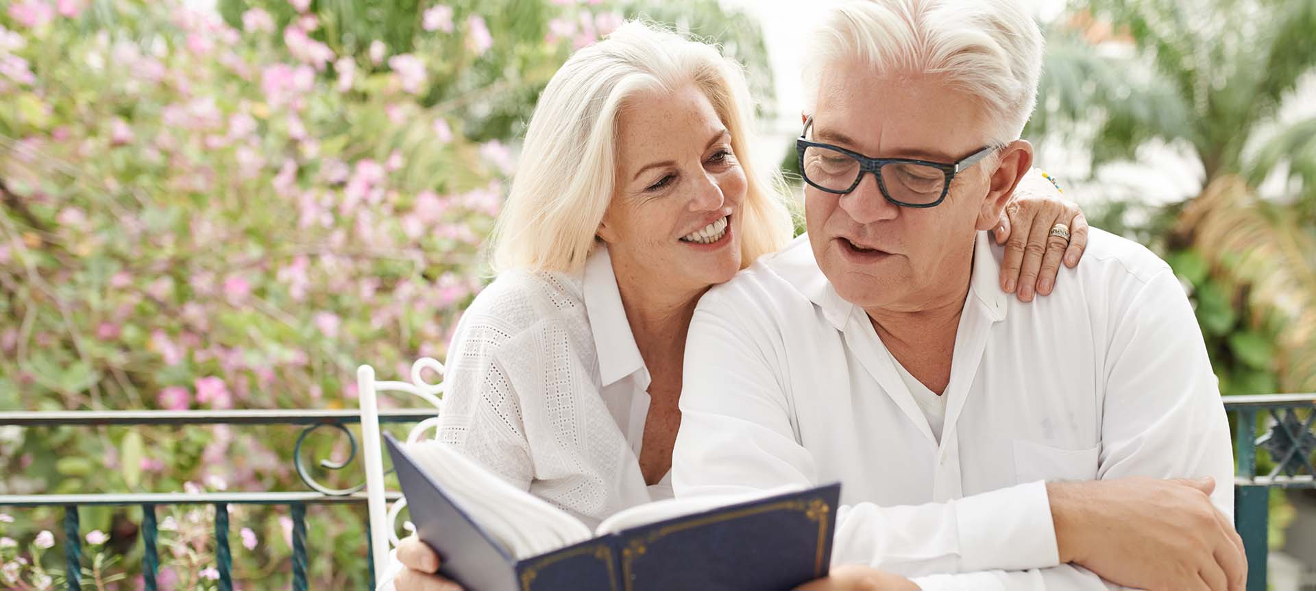 Older couple reading a book together 