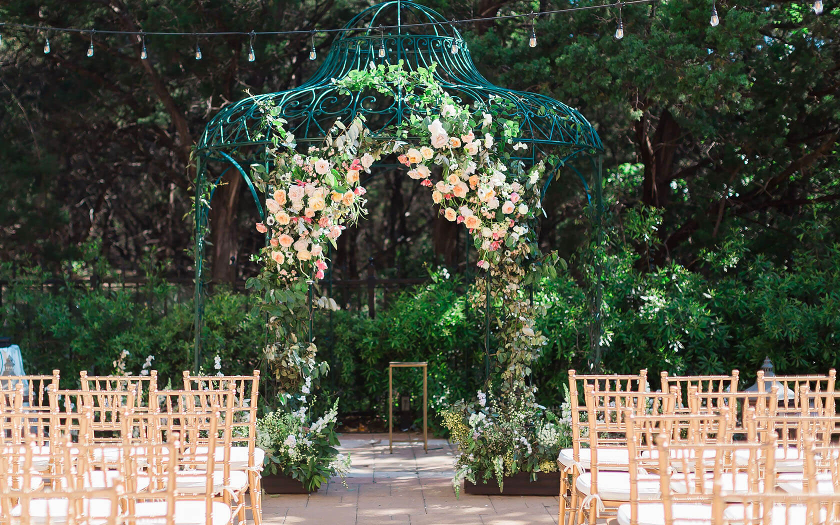 floral arch at the end of a isle 