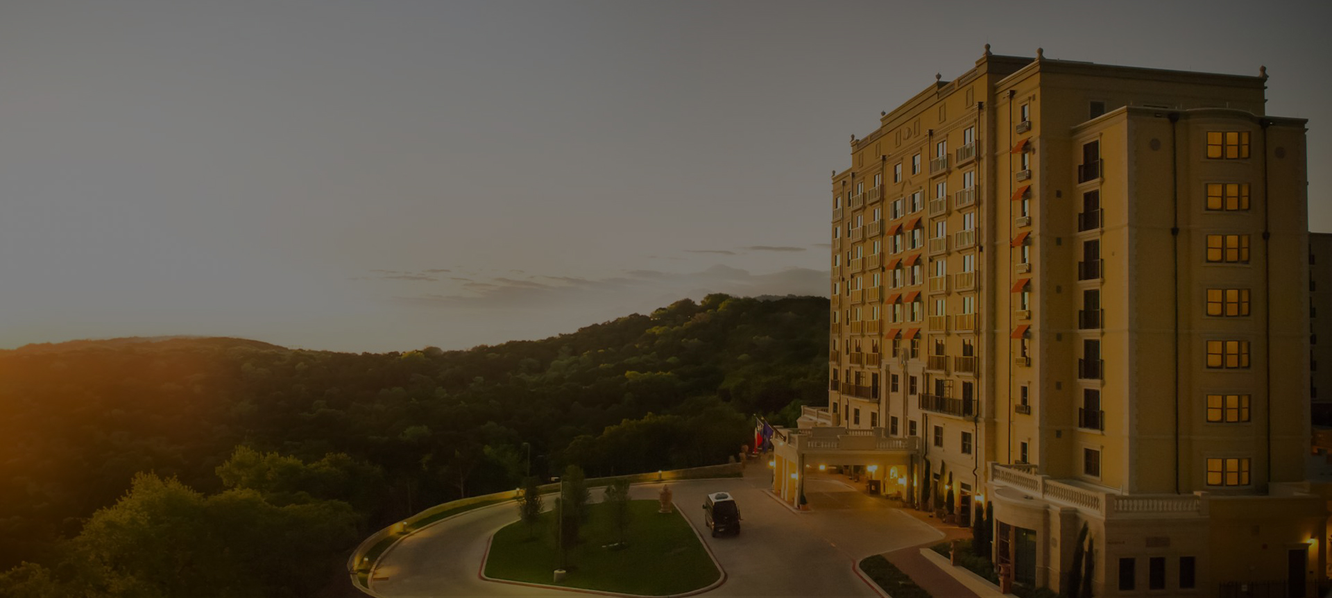 exterior look of the hotel building during sunset