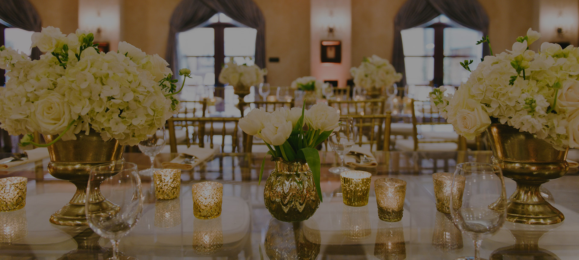 wedding decor on tables at the venue with floral details