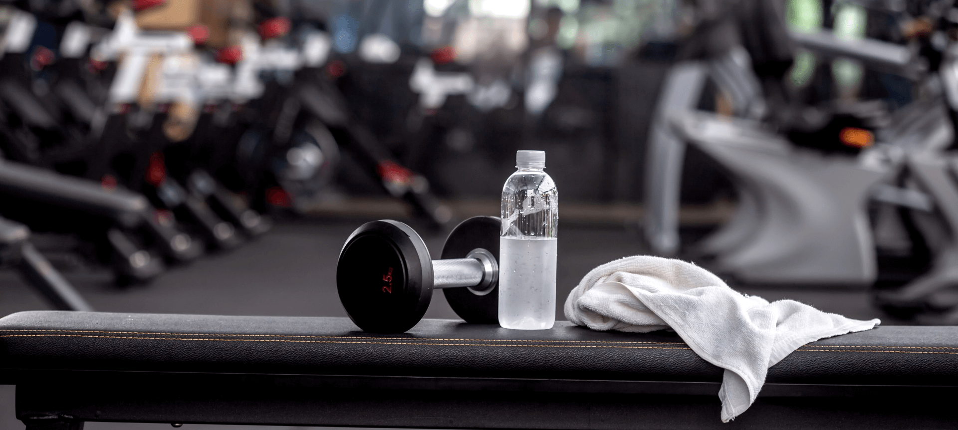 close up of gym equipment and a water bottle in a gym 