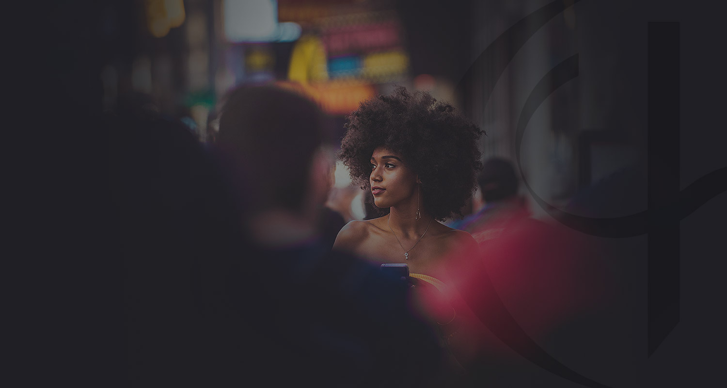 View of an afro american woman walking on the street