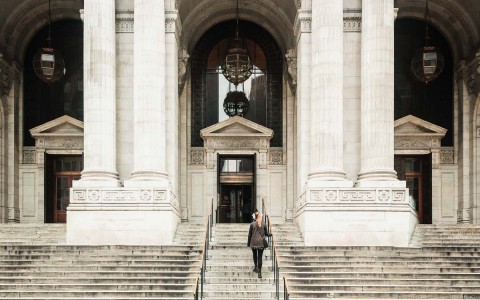woman walking up the stairs in the exterior 