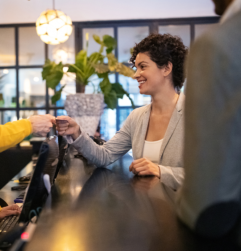 woman receiving her room key