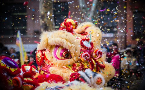 lion dance and confetti during chinese new year celebration