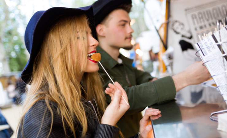 couple eating from food truck
