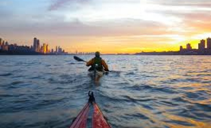 people kayaking down hudson river