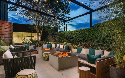 View of an outdoor patio full of comfortable sofas and cushions