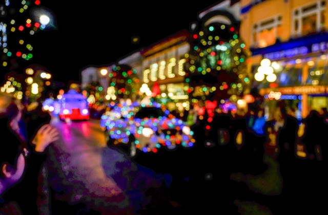 a christmas parade marches down a street
